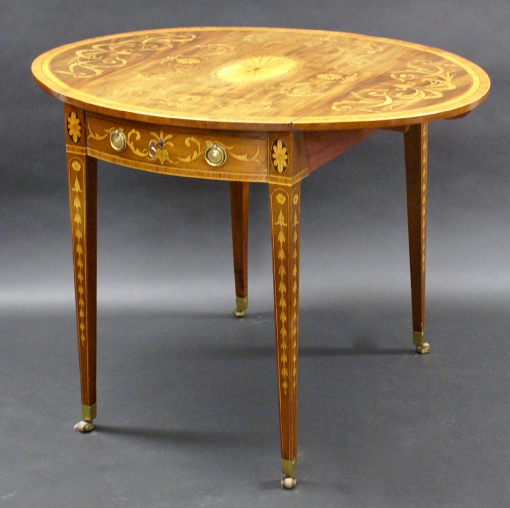 A Sheraton period inlaid oval Pembroke table