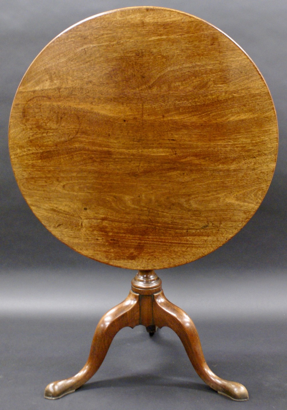 A George III tripod in excellent condition.