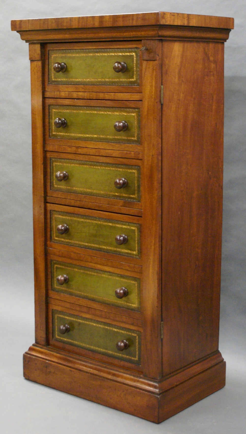 A Victorian mahogany wellington chest of drawers