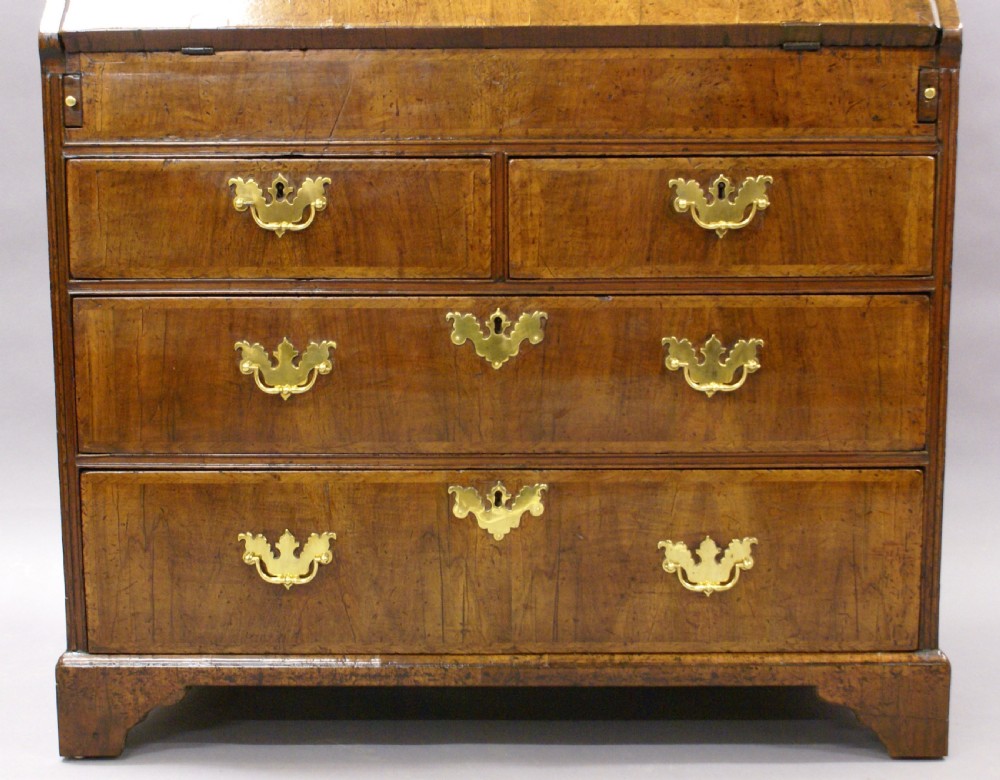 A small George I walnut bureau View IV