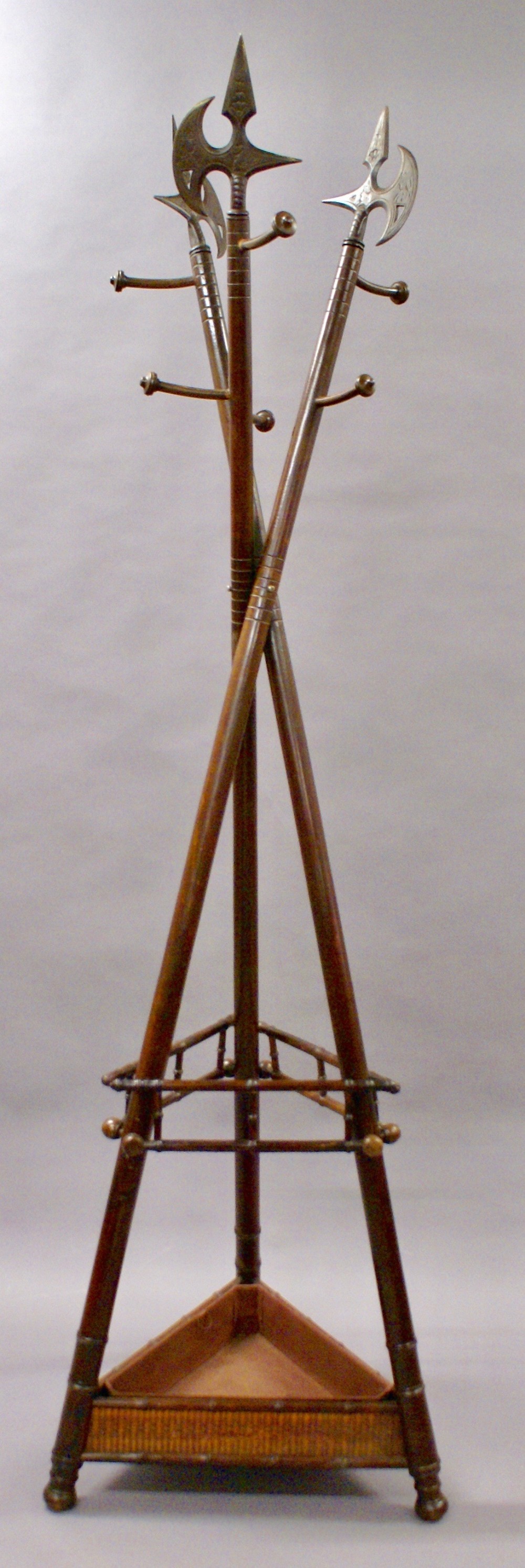 A decorative and unusual coat and stick stand