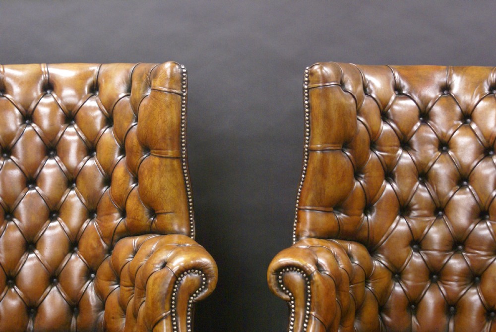 A superb pair of barrel back leather wing chairs View III