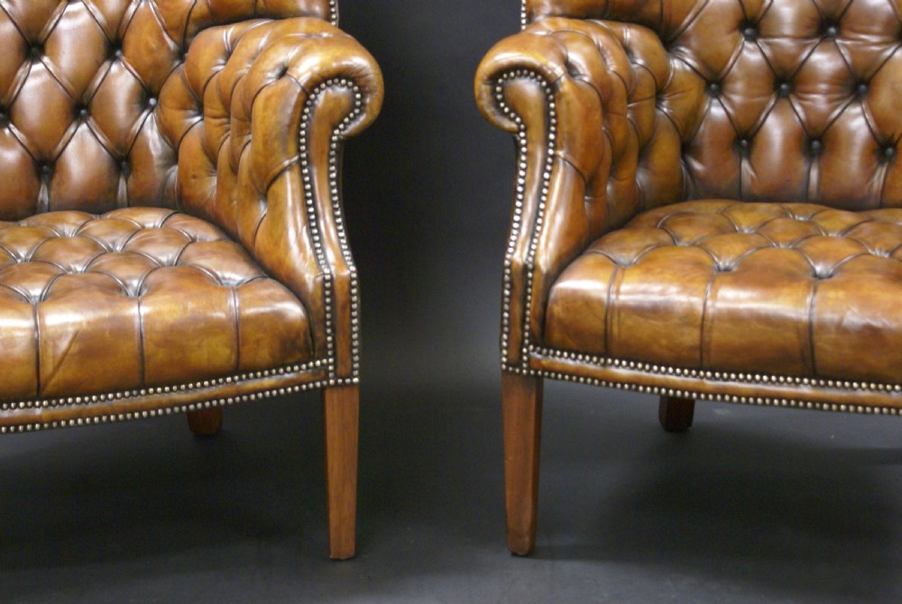 A superb pair of barrel back leather wing chairs View IV