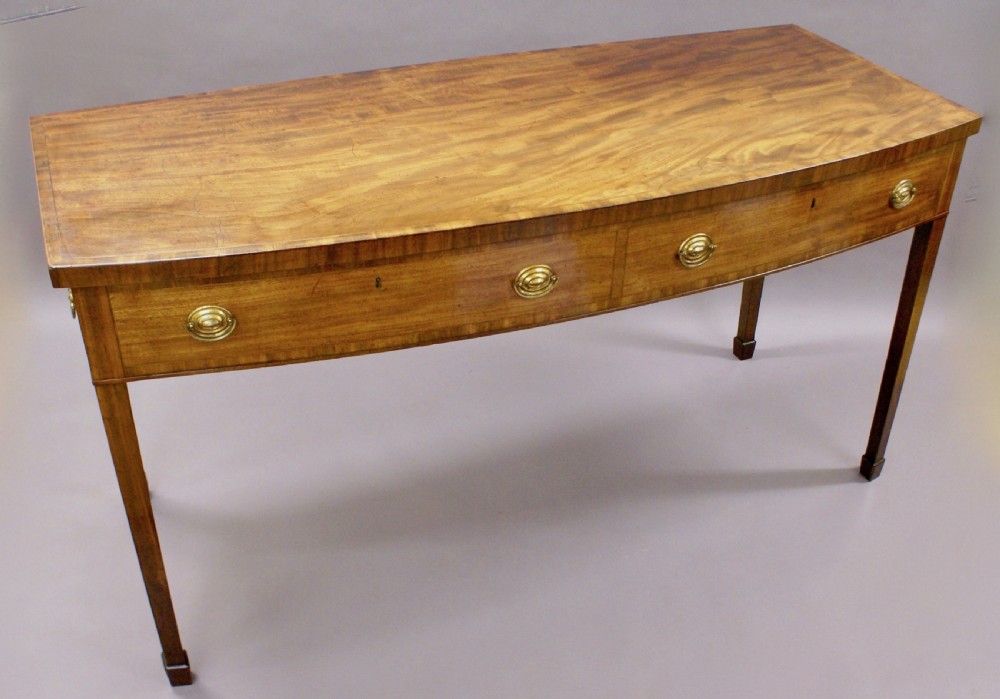 An unusual George III bow-fronted serving table View II