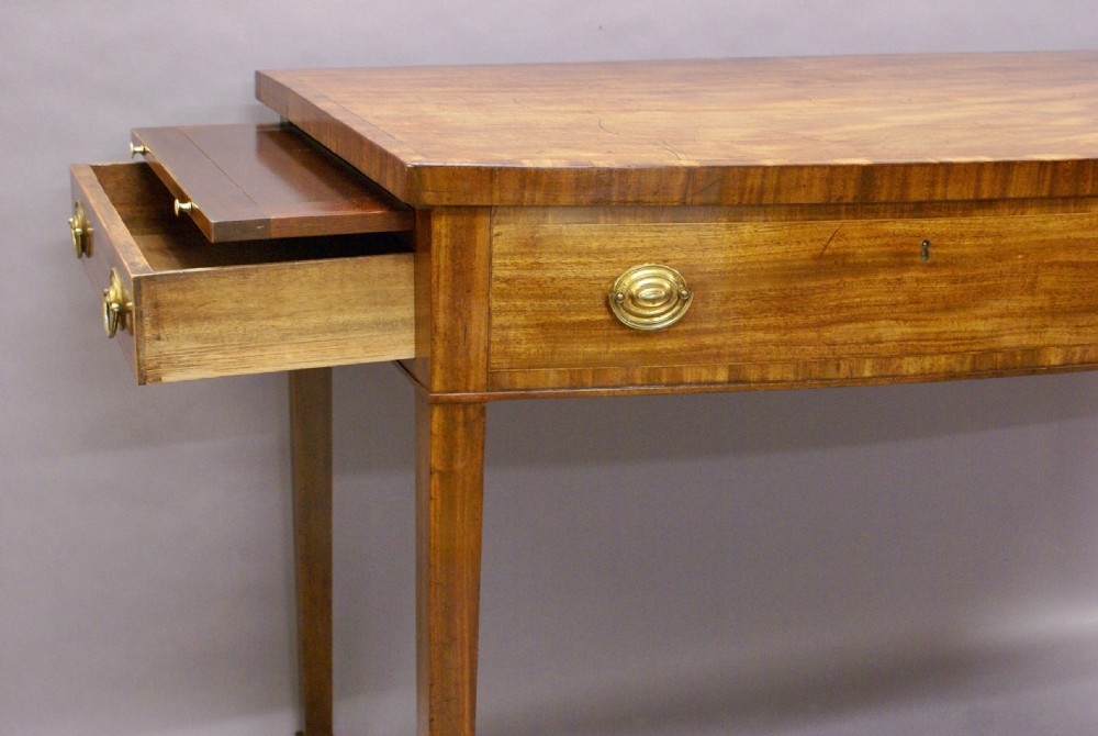 An unusual George III bow-fronted serving table View IV