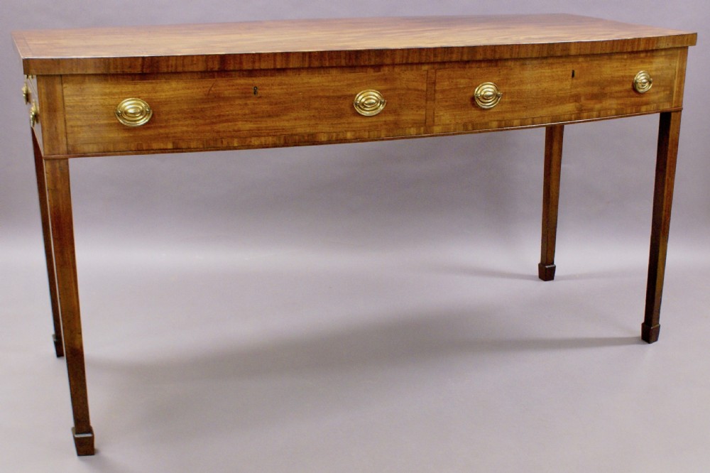 An unusual George III bow-fronted serving table View VI