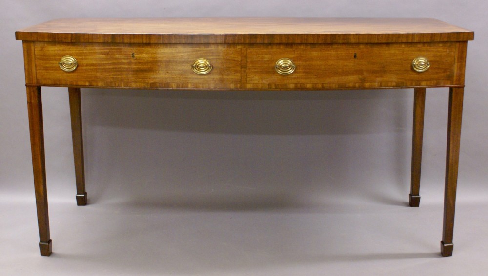 An unusual George III bow-fronted serving table View VII