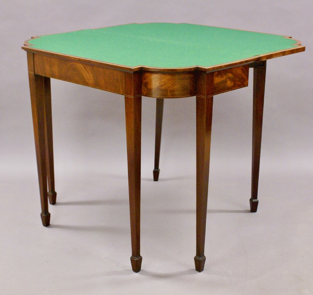 An unusual George III mahogany card table View IV