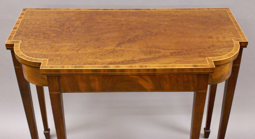 An unusual George III mahogany card table View VI