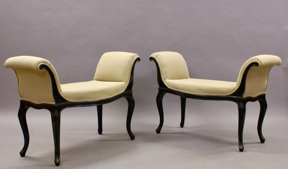 A pair of ebonised window seats
