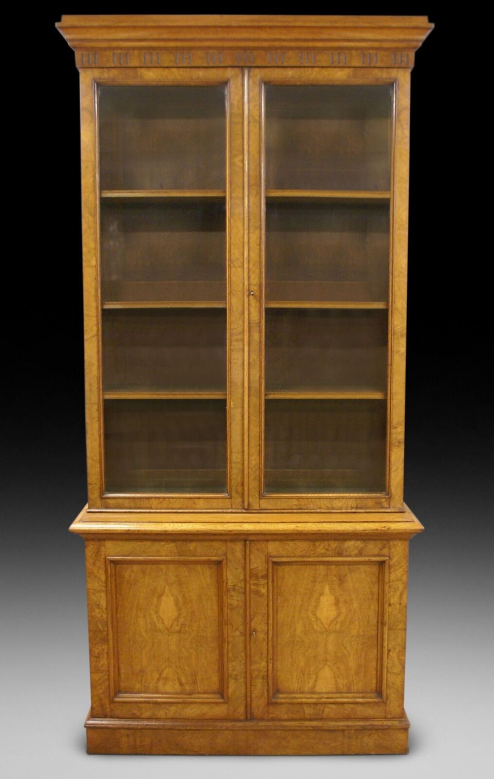 A figured Elm bookcase