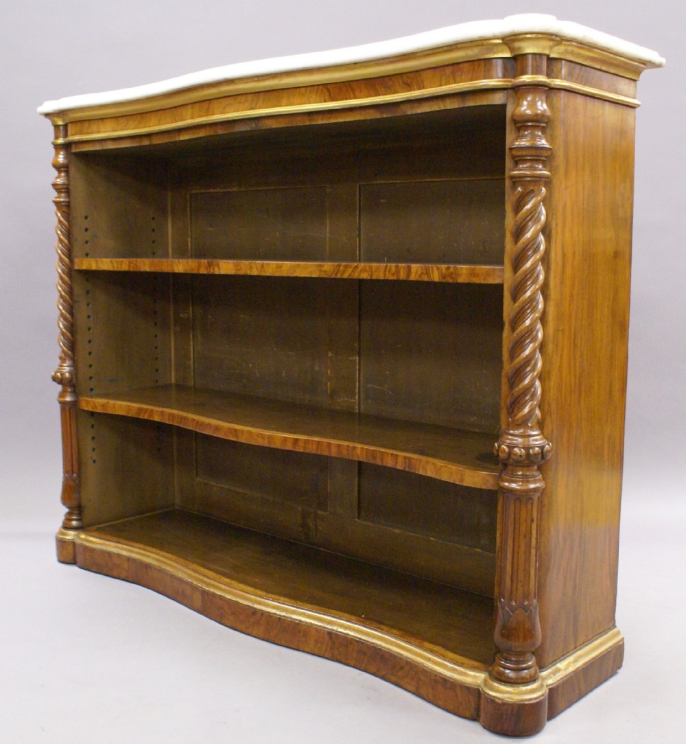 A walnut open bookcase by T.Seddon