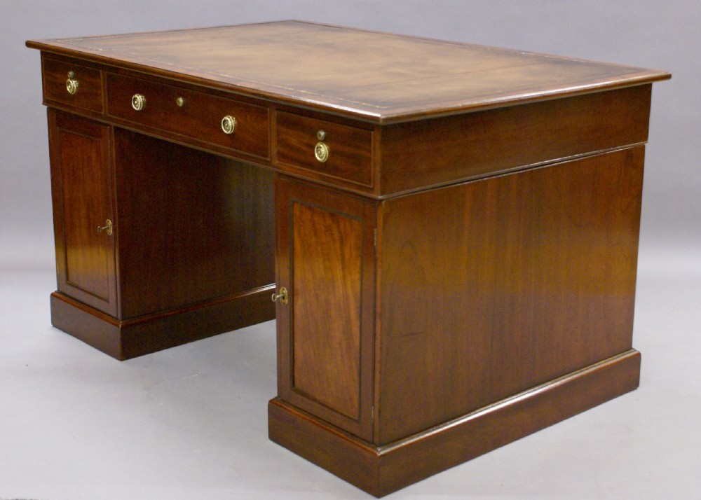 A George III mahogany partners desk View II
