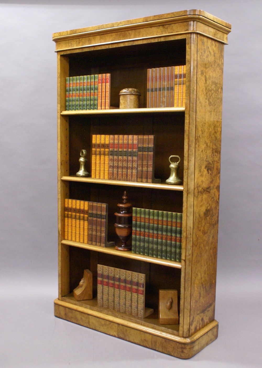 A Victorian burl walnut open bookcase