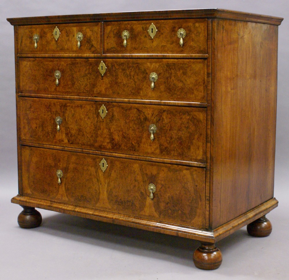 A Queen Anne walnut chest of drawers