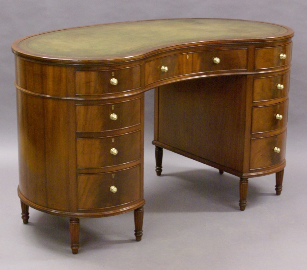 A kidney shaped desk by Howard & Sons View IV
