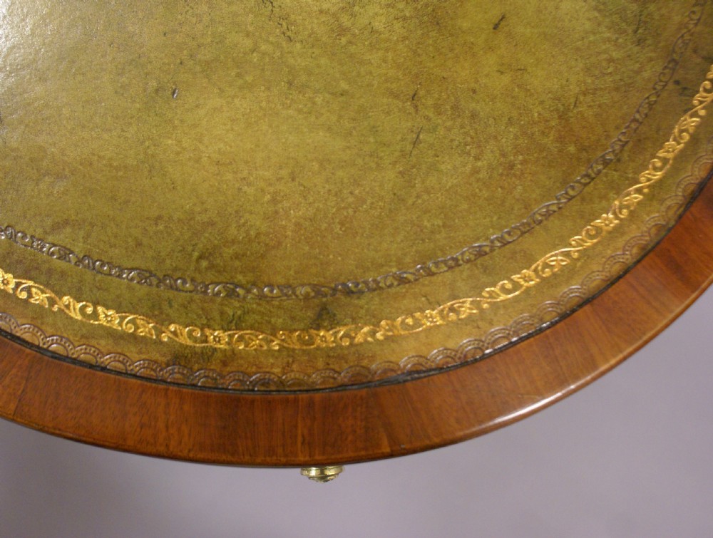 A kidney shaped desk by Howard & Sons View V