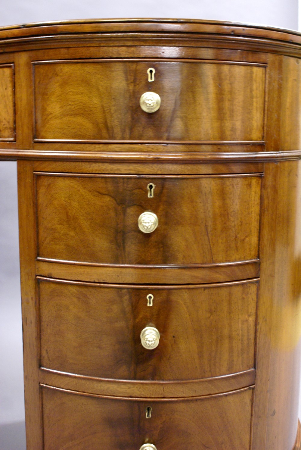 A kidney shaped desk by Howard & Sons View VI