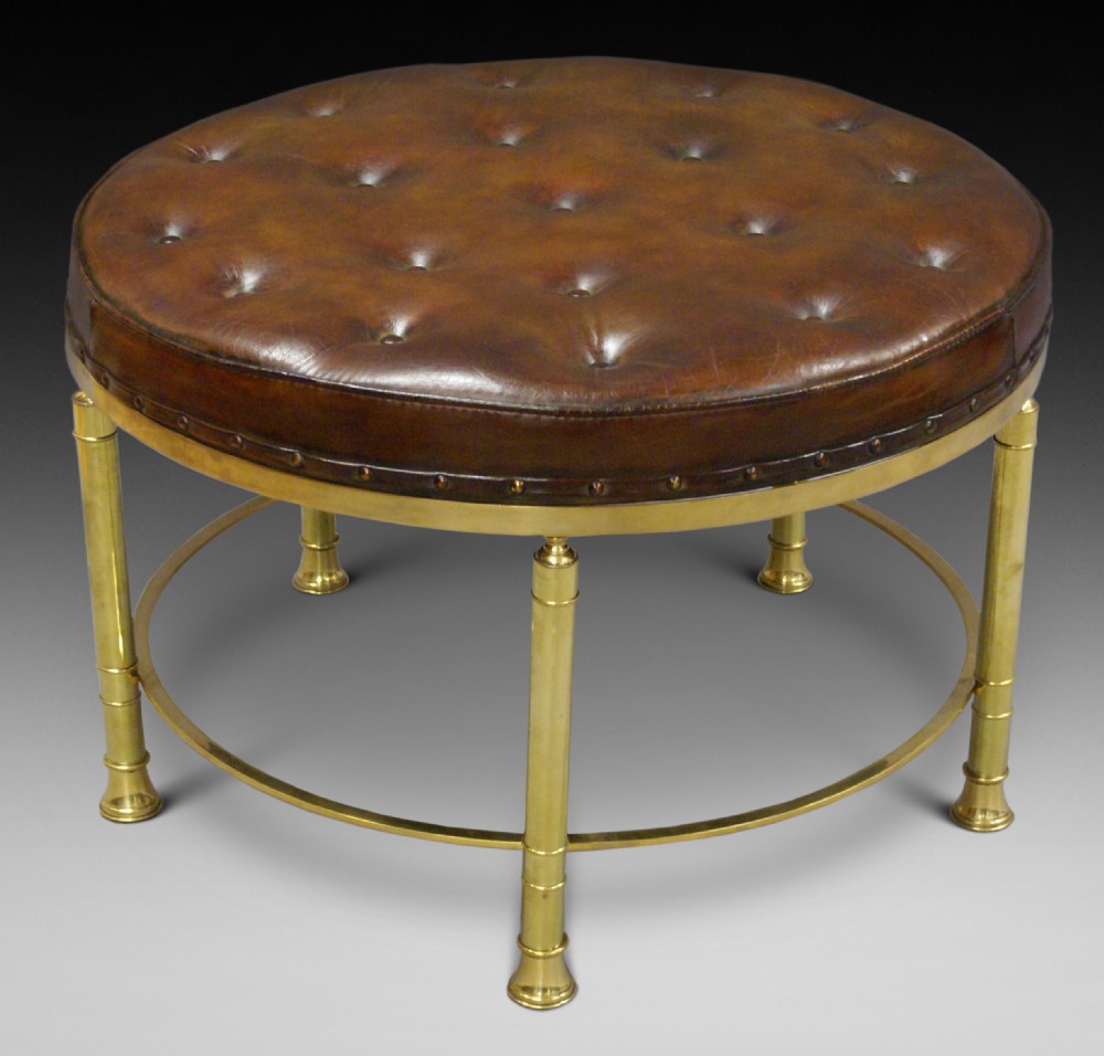 A large circular brass & leather stool