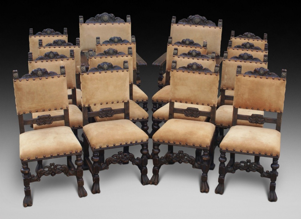 A set of 16 oak dining chairs View III