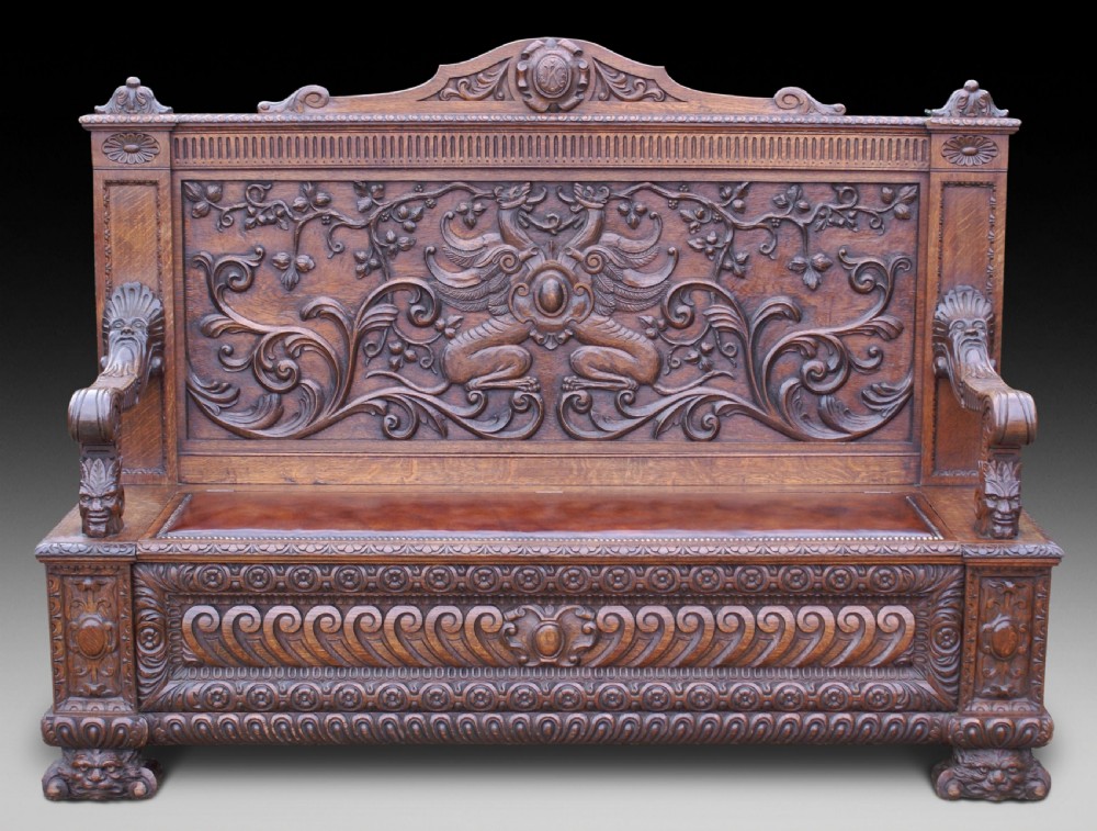 A very impressive carved oak hall bench