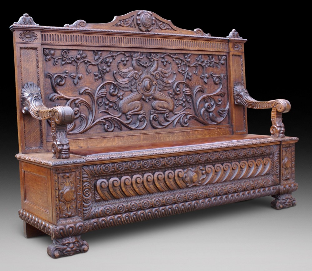 A very impressive carved oak hall bench View II