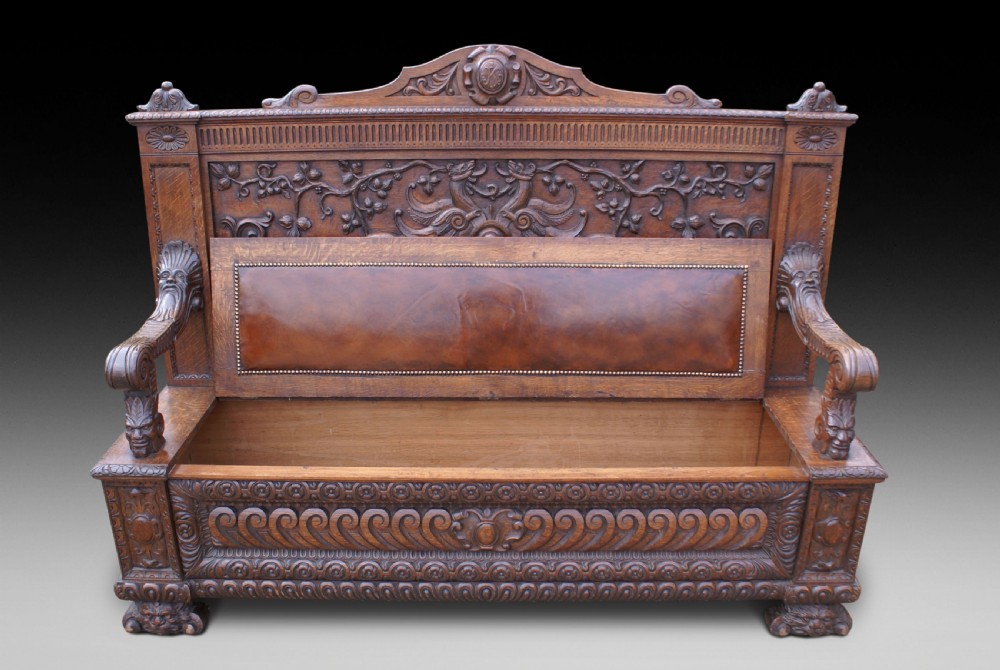 A very impressive carved oak hall bench View III