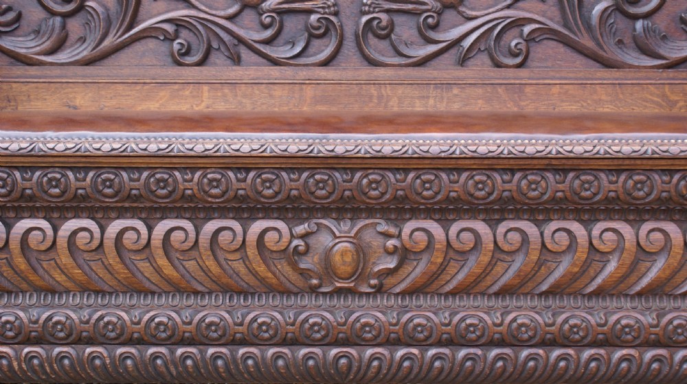 A very impressive carved oak hall bench View VII