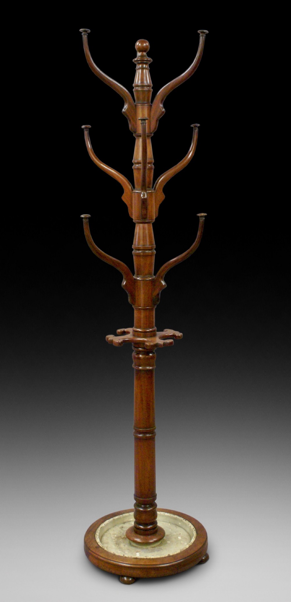 A large mahogany hat and stick stand