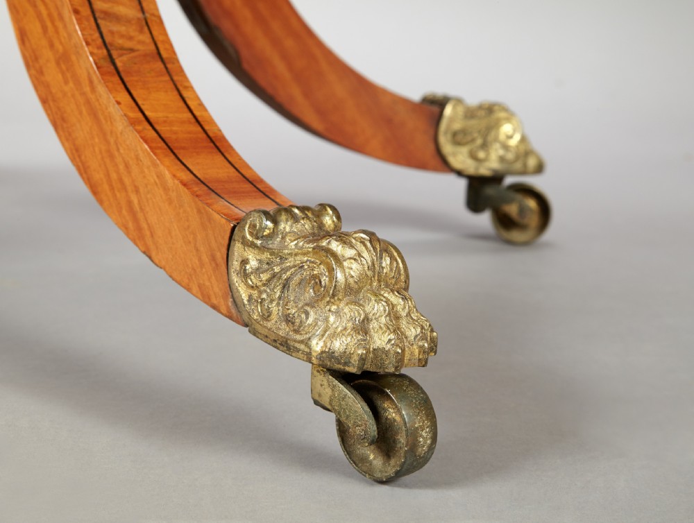 A 19th century late Regency Period satinwood and ebony inlaid pedestal card table. View VI