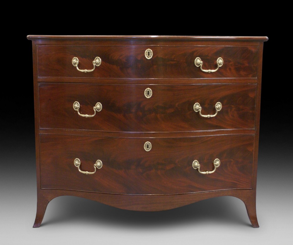 A George III serpentine chest