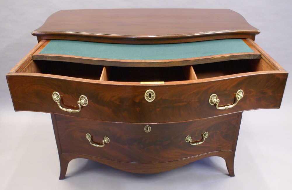 A George III serpentine chest View V