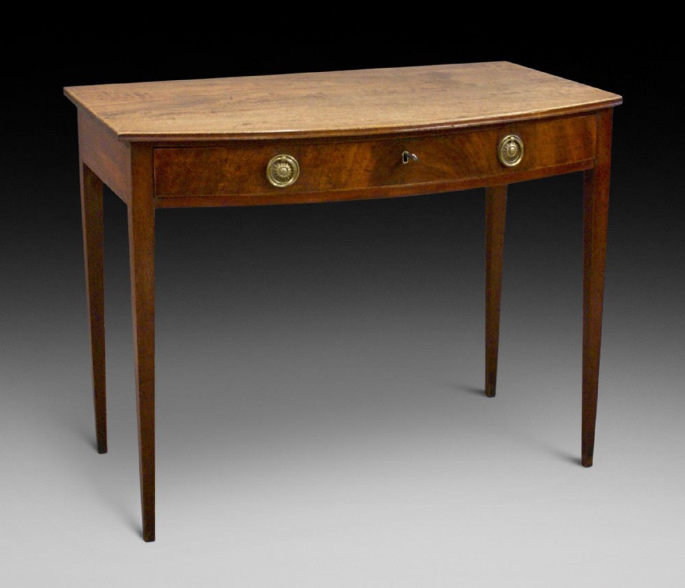 A George III bow-fronted side table