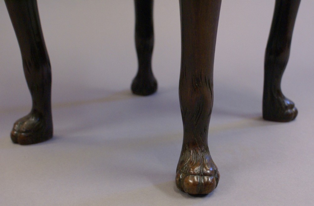 A cylindrical George II mahogany cellarette bound in brass, featuring side carry handles, a zinc liner, and cabriole legs. View V