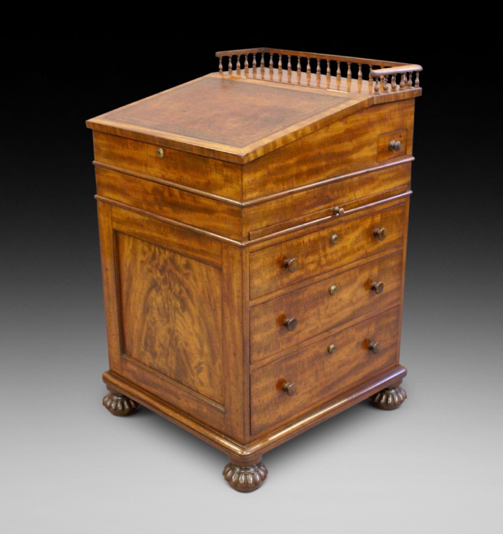 A Gillow sliding top Davenport