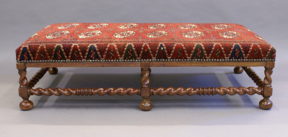 A very large walnut stool View III
