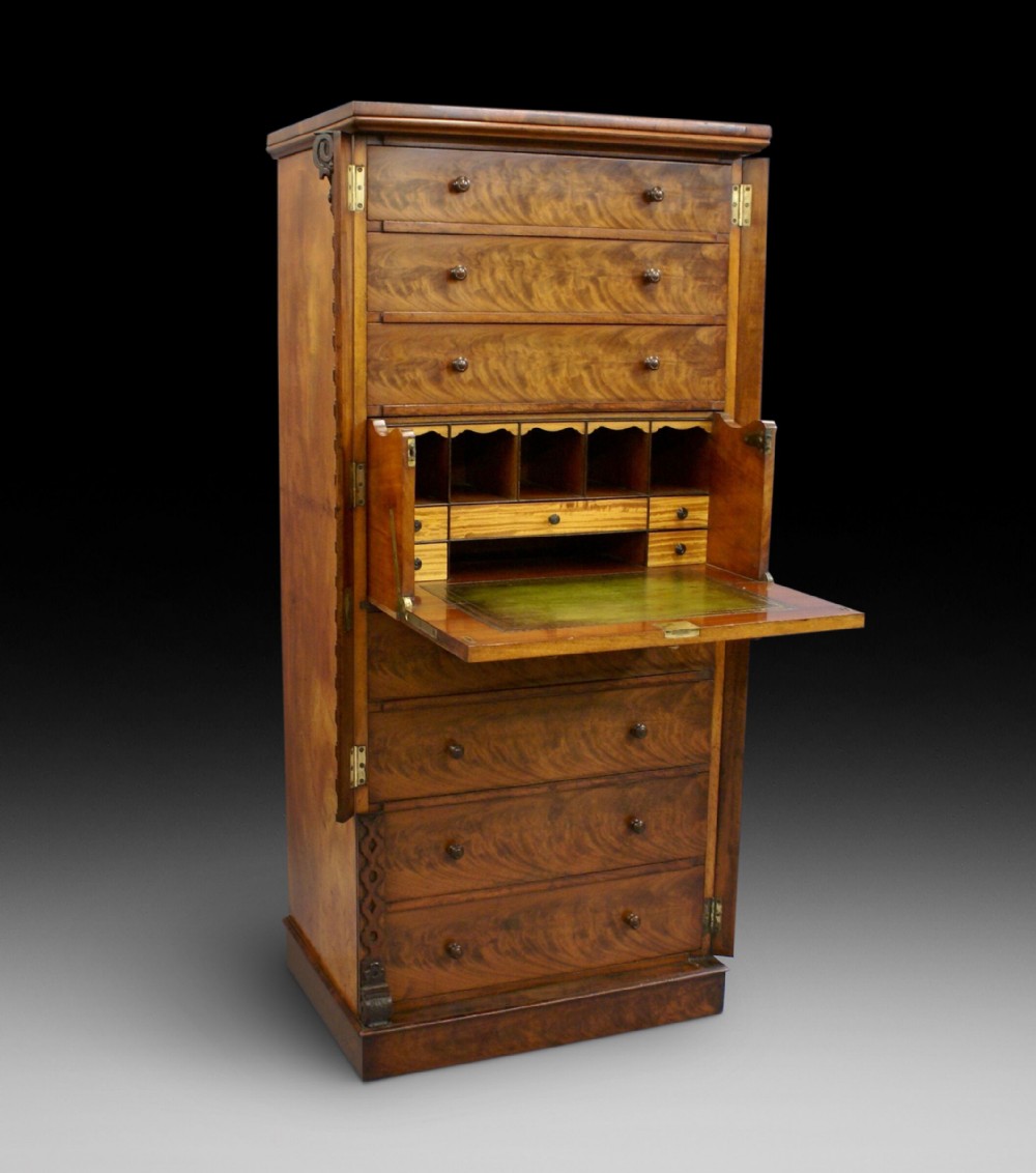 A flame mahogany, secretaire Wellington chest