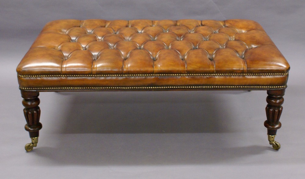 A very large leather upholstered stool View II