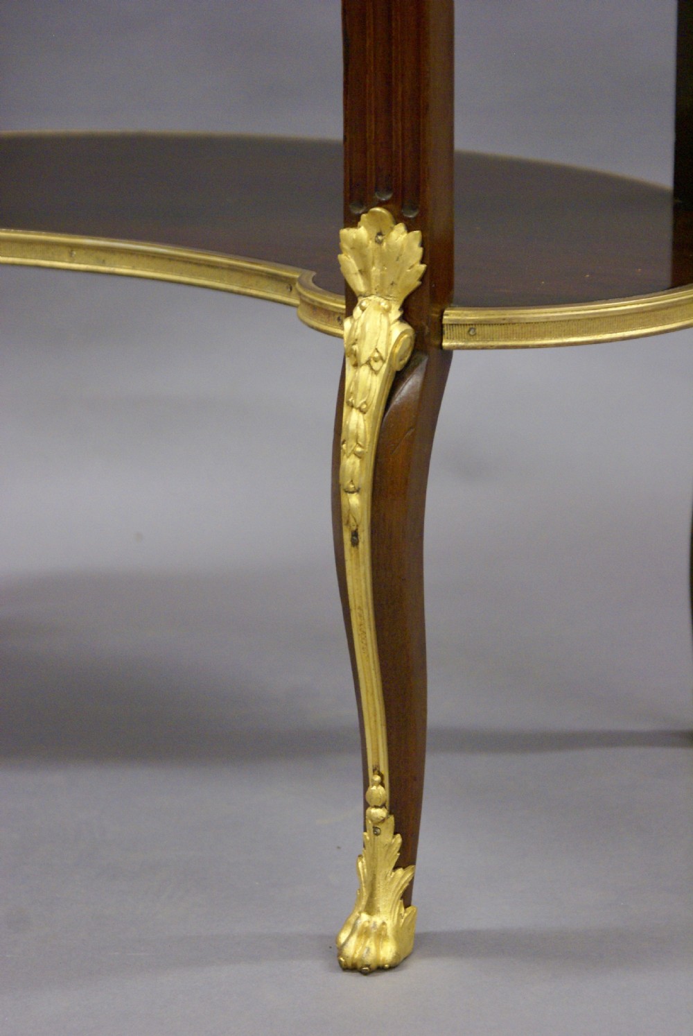 A fine French mahogany and ormolu mounted table View VII
