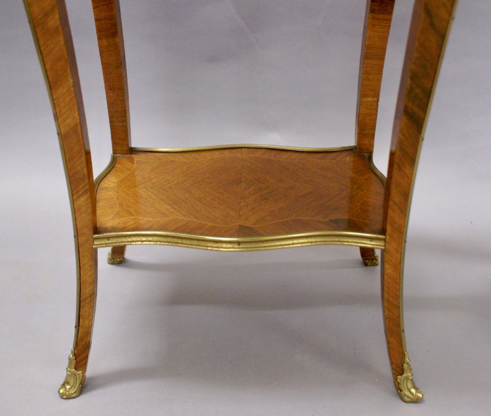 A superb pair of French side tables View V