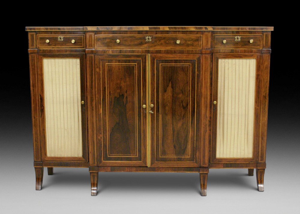 A Regency rosewood breakfront cabinet