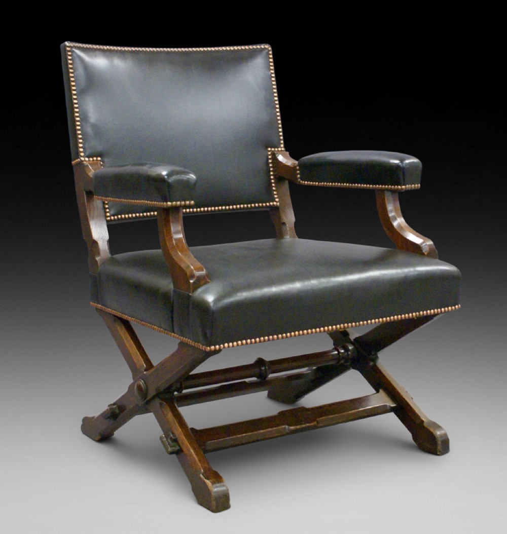 An Arts and Crafts library arm chair of impressive