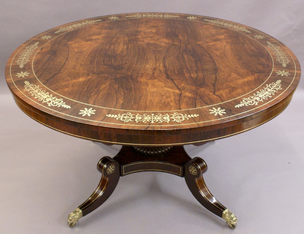 A Regency rosewood and brass inlaid centre table View III