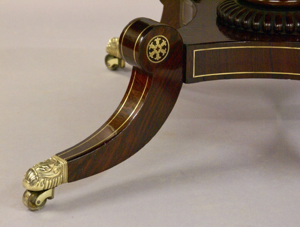 A Regency rosewood and brass inlaid centre table View IV