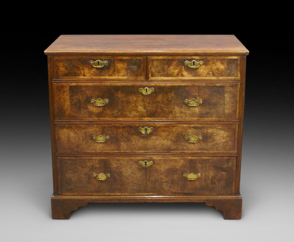 A walnut chest of exceptional colour and originality