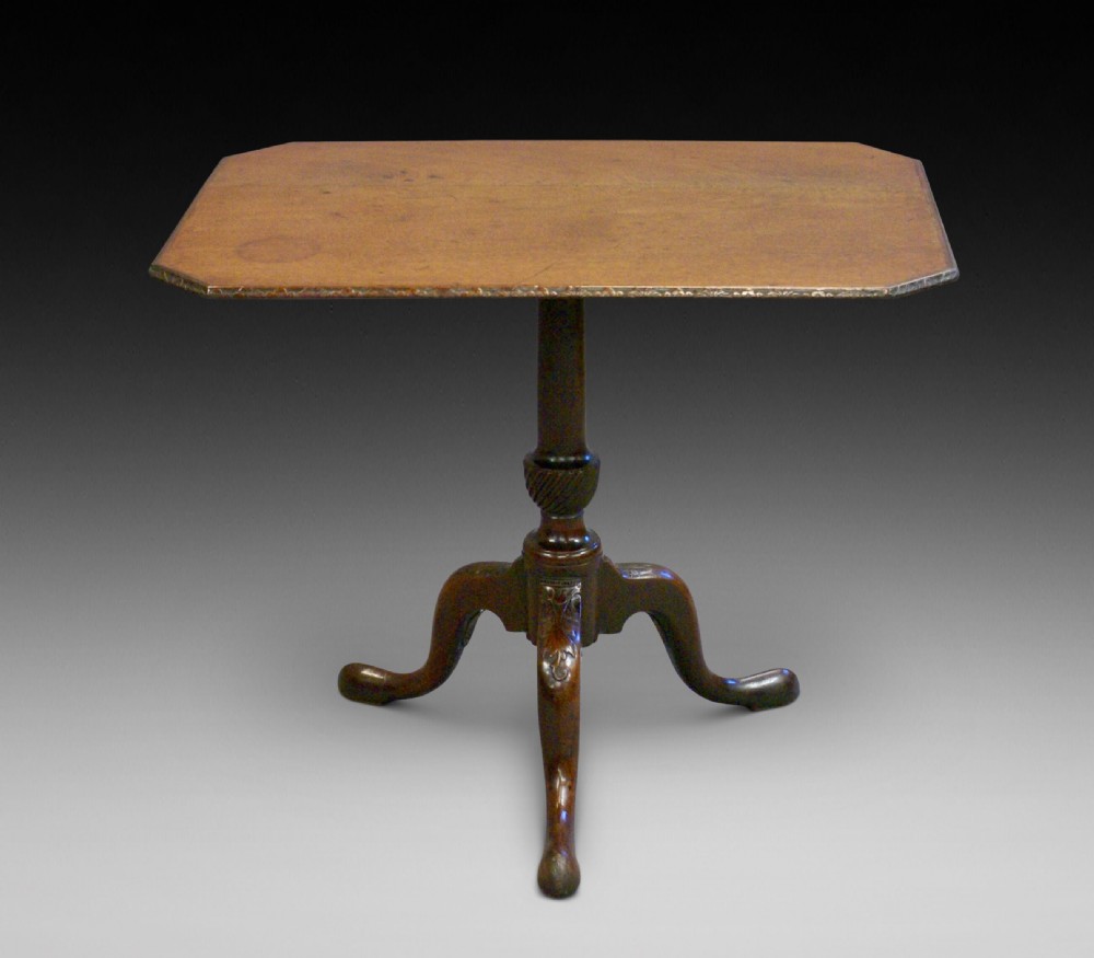 An 18th century carved tripod table