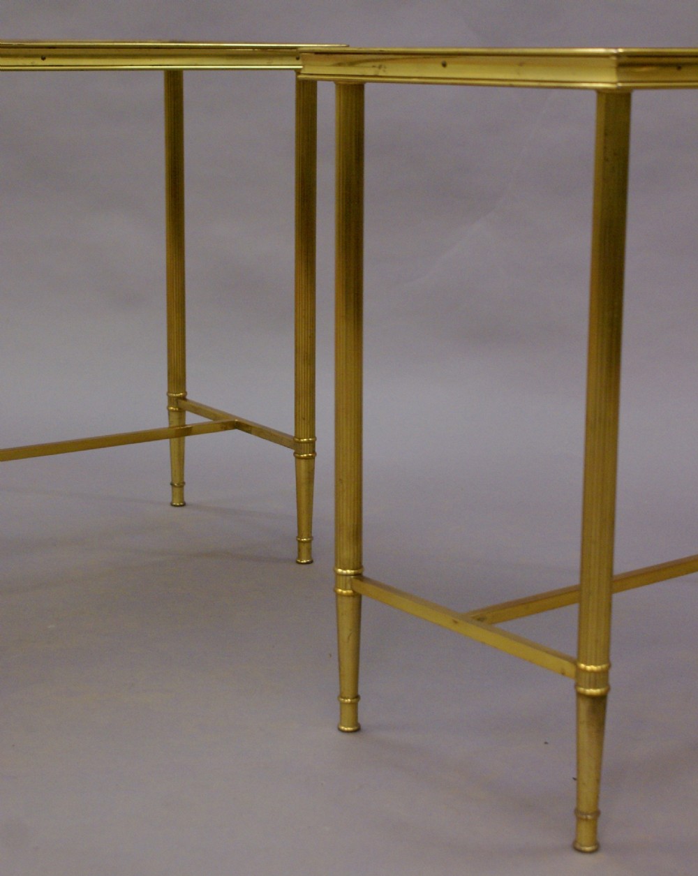 A pair of decorative brass tables  View V