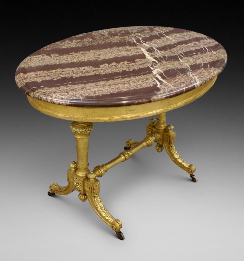 An attractive & unusual marble & gilt centre table