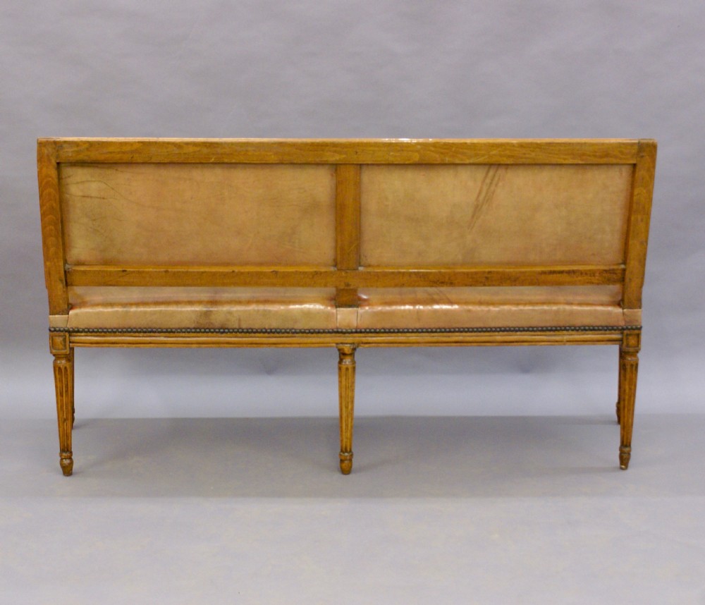 A diminutive walnut & leather bench. View VI