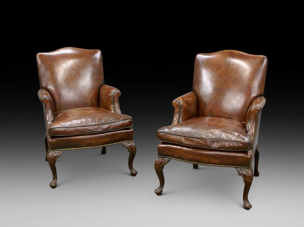 A pair of Georgian style Gainsborough chairs